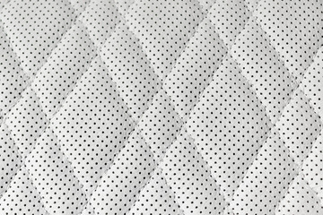 Modern luxury Car white leather interior. Part of perforated leather car seat details. White Perforated leather texture background. Texture, artificial leather with stitching. Perforated leather seats