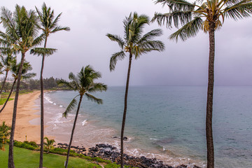 View at empty Kamaole beach II, Kihei Maui. People left the beach in a light of approaching rain brought tropical storm Erik