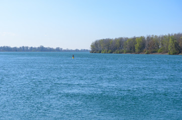 Channel marker or navigation buoy in a river