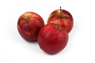 Group of natural unwaxed organic red apples on white background