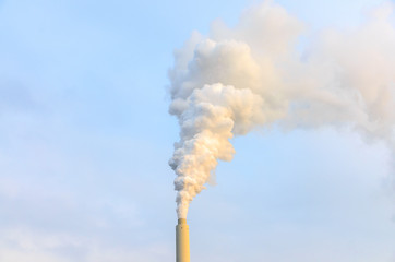 Smoke billowing from an industrial chimney