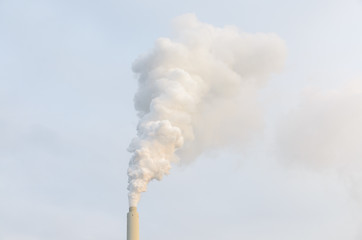 Smoke billowing from an industrial chimney