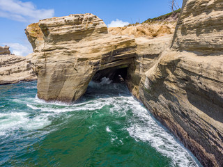 Aerial view at a cliff and a cave of Cape Kiwanda