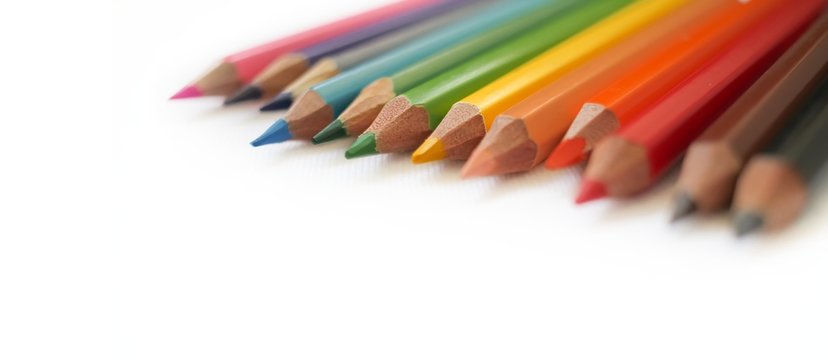 Colorful colored pencils close up, art supplies for painting education in classroom, kids stationary in school on white background, rainbow unicorn color, diversity,happy life, gay pride, lgbt concept