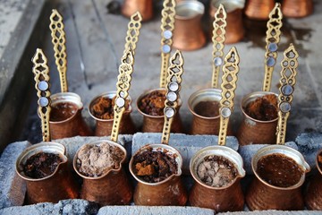 Turkish coffee in coffee pot prepared in embers
