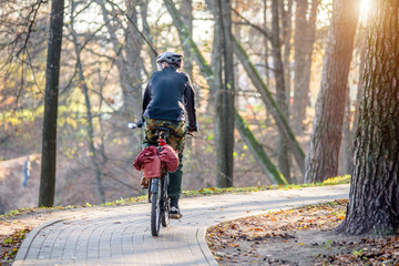 Naklejka premium Cyclist ride on the bike path in the city Park