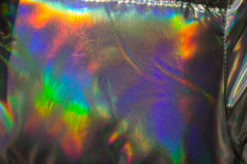 Obraz na płótnie Canvas close up holographic jacket , trendy abstract bright background