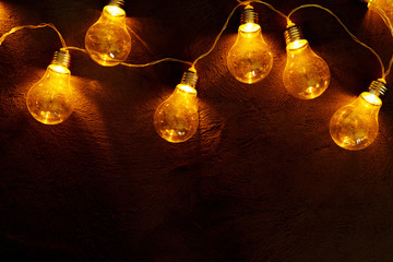 Garland of light bulb lamps in the dark