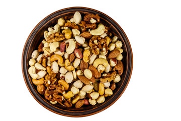 Bowl with mixed nuts isolated on white background. Walnuts, pistachio, almond, peanut, cashew, hazelnut in ceramic bowl. Top view
