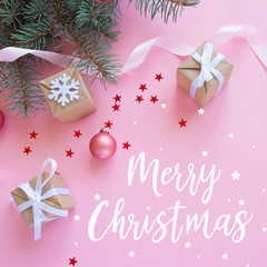 Fototapeta na wymiar Christmas holidays composition on pink background with lettering Merry Christmas
