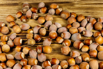 Heap of hazelnuts on a wooden table