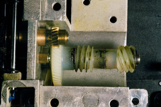 Gears and cogs in brass and nylon in precision machinery.
