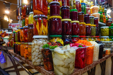 Kiev, UkraineConserved and preserved vegetables in jars at an indoor market.