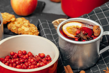 Christmas composition with  hot mulled wine in rustic cup