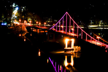 Kiev, Ukraine, The illuminated Pishokhidnyy Mist Cherez Dnipro bridge on the Dnieper river.