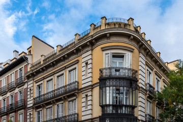 Fototapeta na wymiar Old luxury residential buildings with balconies and enclosed balconies in Salamanca district in Madrid