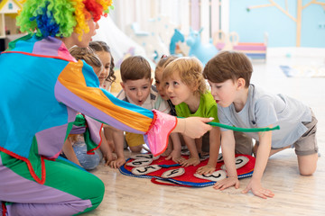 happy children and clown on birthday party