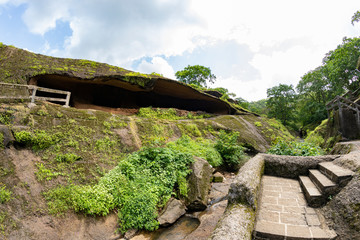 Fototapeta na wymiar Kanheri caves city Mumbai state maharashtra in India. It is a ancient monuments and old temple building related to God budha. It is situated in the mid of forest in borivali on 21 August 2019