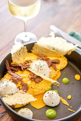 Dinner in restaurant. Pumpkin Risotto with with duck and parmesan cheese mousse. Seasonal autumnal recipe - risotto with organic pumpkins.