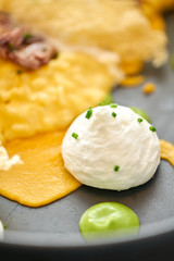 Close-up Pumpkin Risotto with with duck and parmesan cheese mousse. Seasonal autumnal recipe - risotto with organic pumpkins.