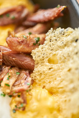 Close-up Pumpkin Risotto with with duck and parmesan cheese mousse. Seasonal autumnal recipe - risotto with organic pumpkins.
