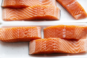 fresh salmon, cut into pieces and ready for cooking. fish cutting