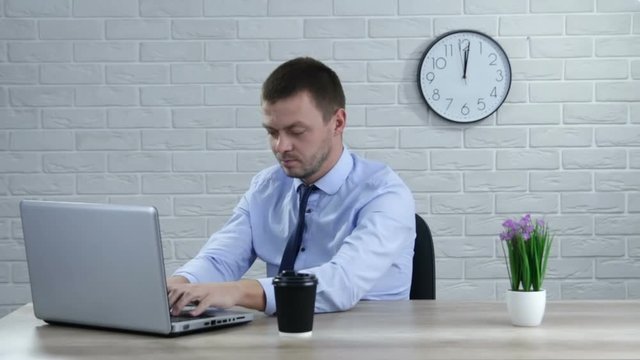 Businessman with laptop working at modern office