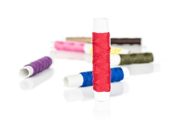 Group of eight whole sewing thread spool isolated on white background