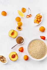 Top view image of healthy breakfast with oats and apricots, honey and sugar. Flatlay with text space
