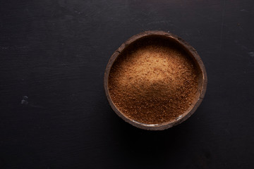 half of coconut's shell  with coconut sugar