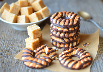 Shortbread chocolate cookies and cane sugar cubes