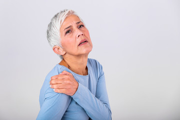 Senior woman with shoulder pain. Elderly woman is enduring awful ache. Shoulder Pain In An Elderly...