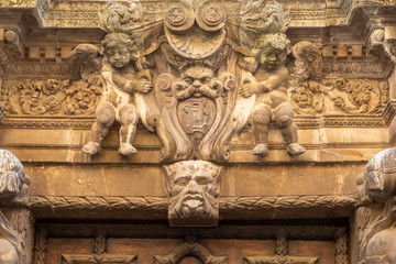 old door and statues in the old town of Frejus, resort city on the Cote d'Azur in France