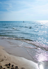 Girl on a sup in the shore of Torre San Giovanni