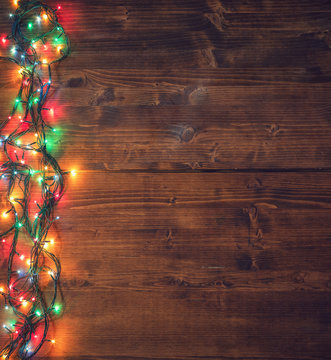 Empty rustic wooden background with Christmas lights