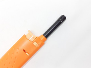 Orange Color Automatic Lighter for Kitchen Utensils and Birthday Candles in White Isolated Background