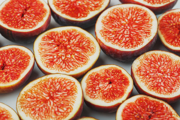 Figs are ripe. Creative diagram of chopped figs on a white background in the form of a texture inscribed in a rectangle. Soft contrast