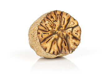 One half of dry brown nutmeg isolated on white background