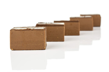 Group of five whole sweet brown viennese nougat isolated on white background