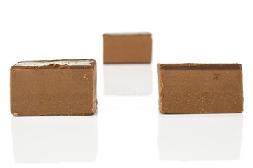 Group of three whole sweet brown viennese nougat isolated on white background