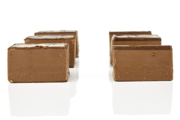 Group of six whole sweet brown viennese nougat isolated on white background