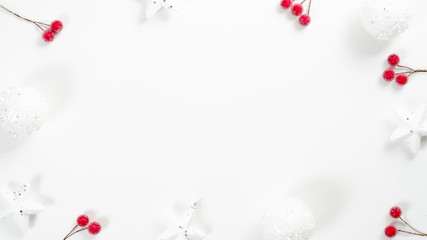 Christmas frame made of red berries, white stars and balls on white background with copy space. Xmas banner mockup, New year greeting card template, winter holidays postcard