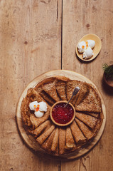  Russian pancakes with red caviar and sour cream . 