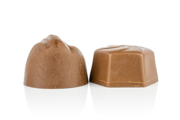 Group of two whole light brown delicious chocolate praline isolated on white background