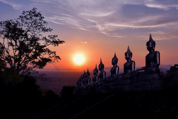 Fototapeta na wymiar The golden Buddha statue of Phu Salao temple in beautiful sunset moment at Pakse