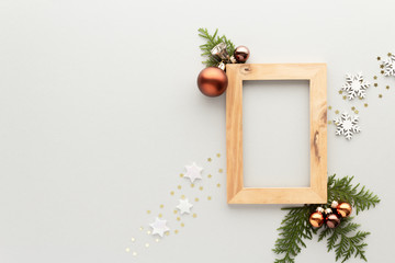 Christmas composition. Wood frame star bauble pine top view background with copy space for your text. Flat lay.