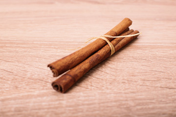 Cinnamon rolls on textured wooden background