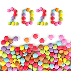 Fototapeta na wymiar 2020 colorful candies isolated on white background