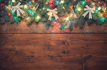 Decorated Christmas garland on the old wooden background