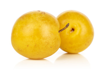 Group of two whole fresh yellow plum isolated on white background